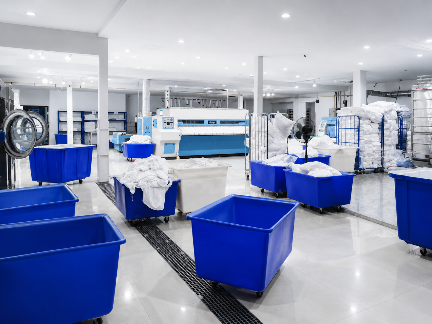 High volume of hotel linen in carts ready for processing at Concept Laundry in Phuket